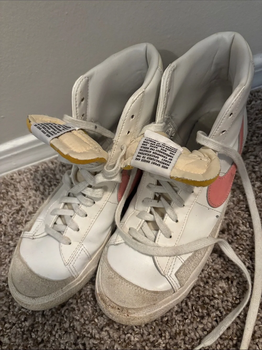 Nike Women's High-Top Sneakers in White with Pink Swoosh